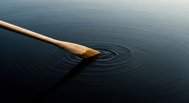 Wooden Oar in Calm Dark Water Creating Ripples in Serene Environment - Powered by Adobe