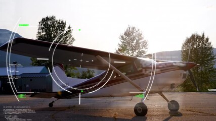 Animation of scanner processing information over small plane at airport - Powered by Adobe
