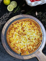 Delicious corn cheese pizza with golden melted cheese and sweet corn topping.