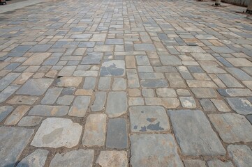 Background featuring a textured surface of natural stone pavement