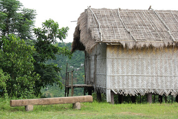 Traditional primitive hut made of bamboo, wood and thatched roofing