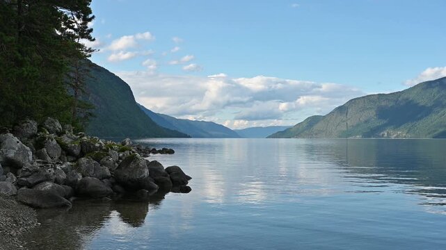 Peaceful landscape of Lake Teletskoye in Altay, Russia. Beautiful summer nature landscape at during daytime
