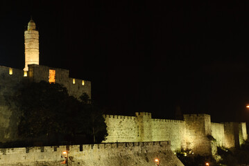 Night view of the Tower of David and western expanse of walls and ramparts of the Old City illuminated by artificial light in Jerusalem. © Yehoshua Halevi
