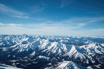 Obraz premium Glittering snowy peaks of the northern mountains under a bright azure sky