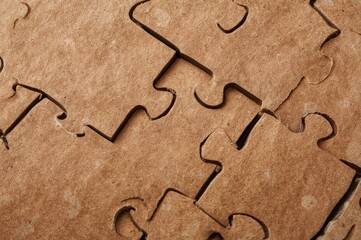 Close-up view of a jigsaw puzzle with a single piece missing, symbolizing business completion and teamwork ideas.