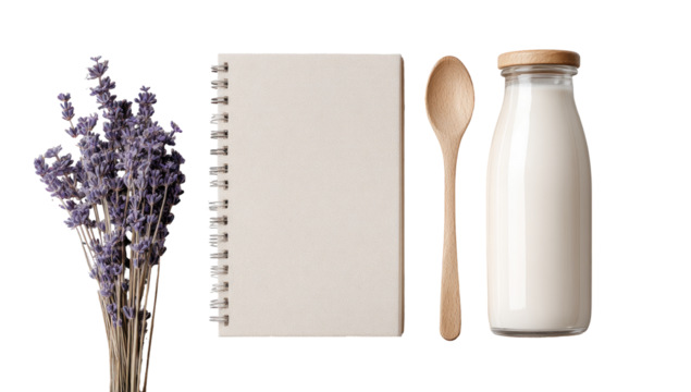 Still life of lavender, notebook, wooden spoon, and milk bottle
