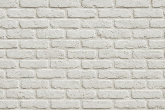 Fototapeta Background featuring a white painted brick wall with a dent for added texture