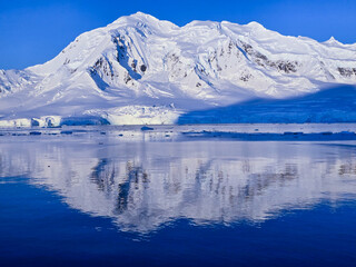 Antarctica with snow capped mountains
