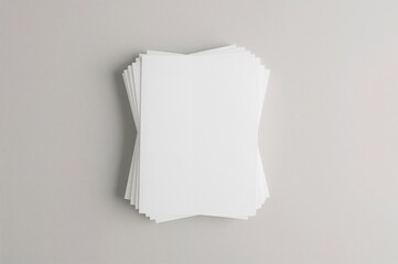 Top view of a pile of empty paper sheets for brochure design, isolated background. Mockup