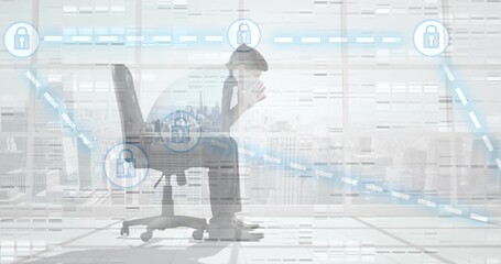 Animation of connections with padlocks over tired caucasian businessman in office - Powered by Adobe