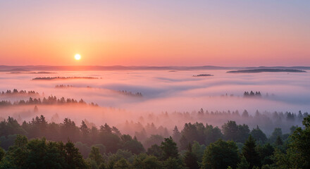 Stunning sunrise over foggy forest valley, painting the sky with warm, vibrant hues and peaceful atmosphere.
