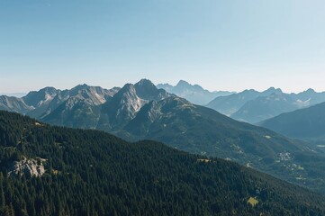 Naklejka premium Panoramic vista of alpine mountain outlines