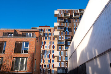 Residential architecture in Ørestad, Copenhagen, Denmark, with stacked modern housing blocks, innovative Scandinavian design reflecting density, balance and urban identity