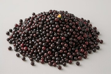 Profile view of a heap of dark elderberries.