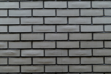 High-resolution image of a grey brick wall, perfect for backgrounds, textures, and design projects.  Clean, simple, and versatile.
