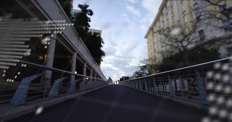 Animation of world map and processing data over pedestrians crossing bridge in city - Powered by Adobe