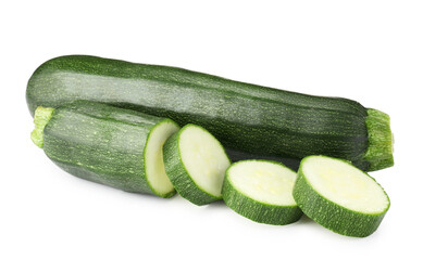 Whole and cut fresh zucchinis isolated on white