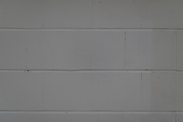 High-resolution image of a grey concrete block wall, perfect for background textures.  Clean, simple, and versatile for design projects.