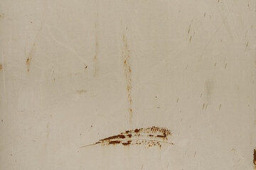 High-resolution image of a beige metal surface with rust and scratches. Perfect for backgrounds, textures, and industrial designs.