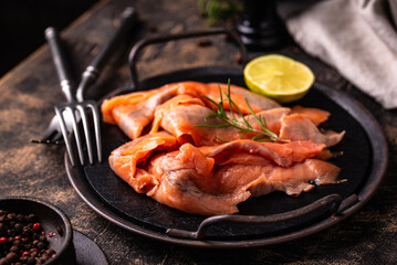 Salted sliced salmon fish with herbs