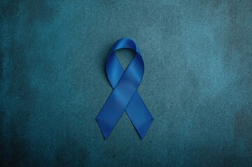 Awareness for Colorectal Cancer, ARDS, Juvenile Arthritis, Tuberous Sclerosis, and Guillain Barre Syndrome Represented by Dark Blue Ribbon on a Hand with Aged Texture
