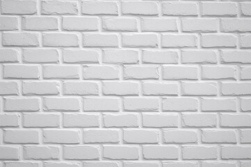 Naklejka premium Gypsum plaster decorative bricks painted grey on a white wall background