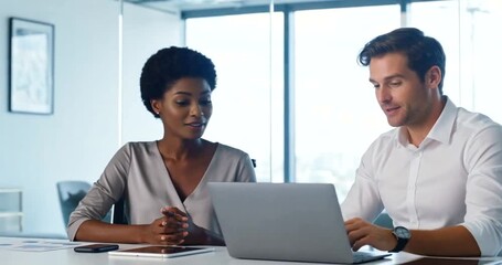 Engaged diverse colleagues collaborating on laptop in modern bright office, discussing project. - Powered by Adobe