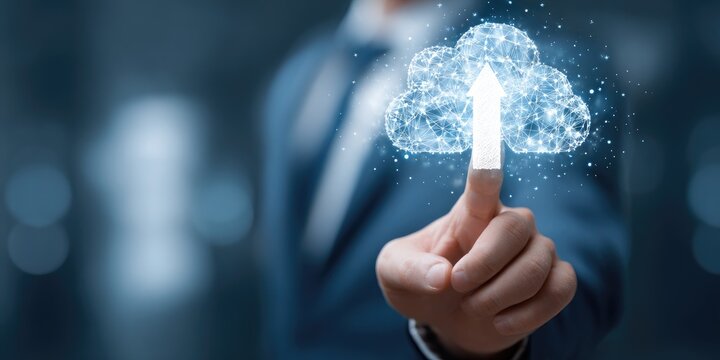 Businessperson's finger touches a glowing cloud icon, representing upward data transfer in the cloud