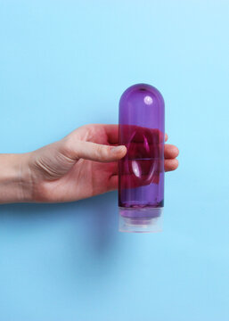 An intimate lubricant for comfortable sex close-up on a colored background.. Vertical photo format