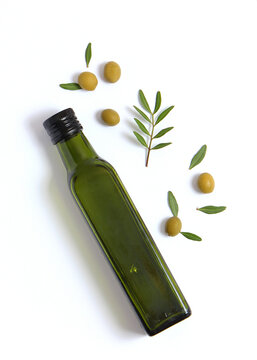 olive oil in a bottle on a white background top view.. Vertical photo format