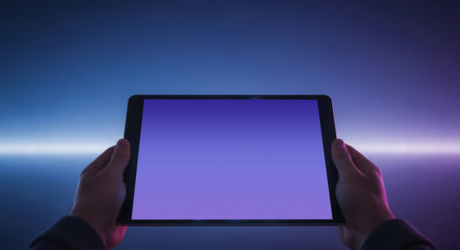 Hands holding a tablet with a blank screen against a vibrant gradient background, showcasing modern technology and digital innovation with copy space for design