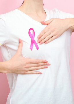 Pink ribbon, the international symbol of breast cancer.. Vertical photo format
