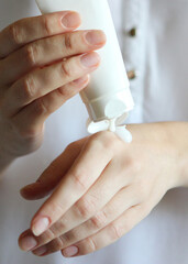 girl smears her hands cosmetic cream. skin care,. Vertical photo format