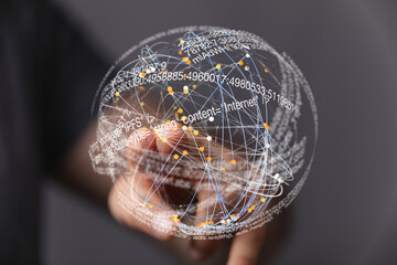 Abstract image of a hand interacting with a digital globe representing global network connections.