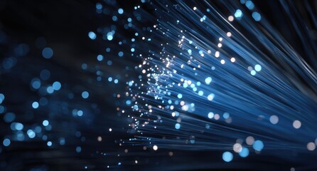 Obraz premium Abstract image of diverging blue light rays with scattered light points