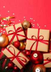 Christmas decorations and gifts on a colored background top view. Vertical photo format