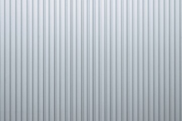 Corrugated silver aluminum sheet with vertical stripe texture as wall background