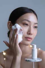 Young Asian Woman Cleansing Her Face with Product, Illuminated by String Lights