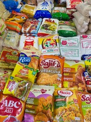 Abundant variety of colorful packaged food items creating a vibrant, appealing grocery store display