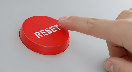 A hand presses a red reset button, signifying a new beginning or a restart.