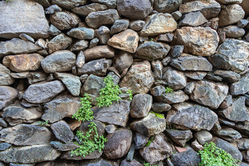 Detail of a traditional Inca stone wall with irregular rocks in Ollantaytambo, Sacred Valley, Peru.