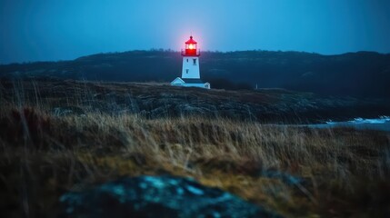 Coastal Lighthouse Illuminated in Twilight with Vibrant Red Beacon