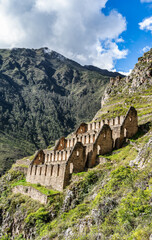 View of the Pinkuylluna Inca ruins built on the steep hillside of Ollantaytambo, in the Sacred Valley of the Incas, Peru.