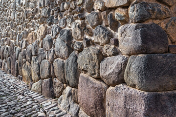 Detail view with the Inca walls made of cut stones in Ollantaytambo Sacred Valley, Peru.