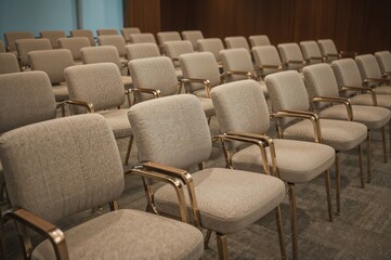 Fototapeta premium Close-up view of vacant chairs in a meeting space.