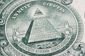 Close up of pyramid and all-seeing eye on American dollar, detail from American banknote of one dollar