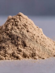 Heap of Brown Powder Close Up Studio Shot on Gray Surface Ingredient Spice Herbal Medicine Supplement Food