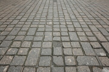 Close-up of aged stone pavement surface texture