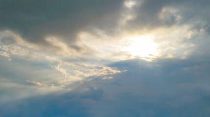Cloudy sky with sunlight breaking through / Langit berawan dengan cahaya matahari menembus