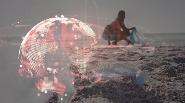 Animation of globe over african american man segregating waste at beach